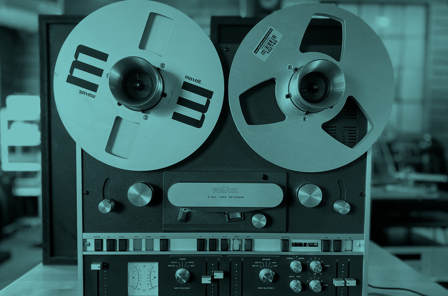 Reel-to-reel tape machine playing back a session